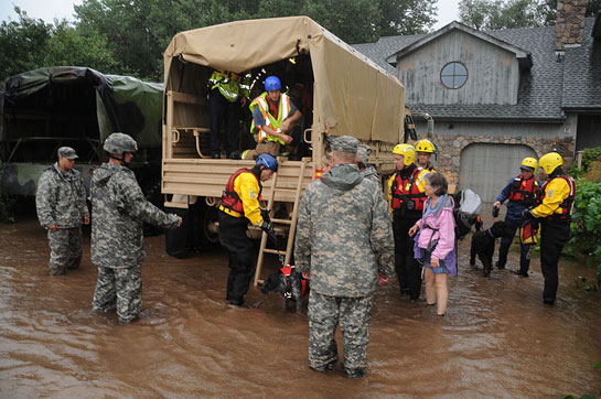 Colorado National Guard assist families from their homes.