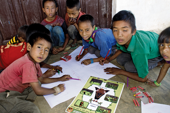 Children of Mimi village in Nagaland draw bats as part of BCIT's outreach activities.