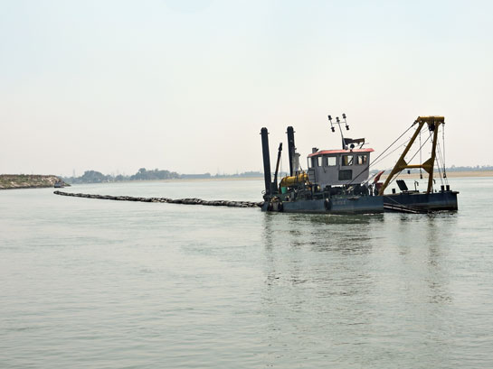 A cutter-suction dredger of the Inland Waterways Authority of India (IWAI) operating in the Vikramshila Dolphin Sanctuary, Bihar.