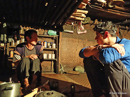 The author (right) tied his study of tiger ecology with anthropology to understand the local socio-economic situation, forest use and people's perceptions around tigers. He lived among the Idu families and worked closely with them.