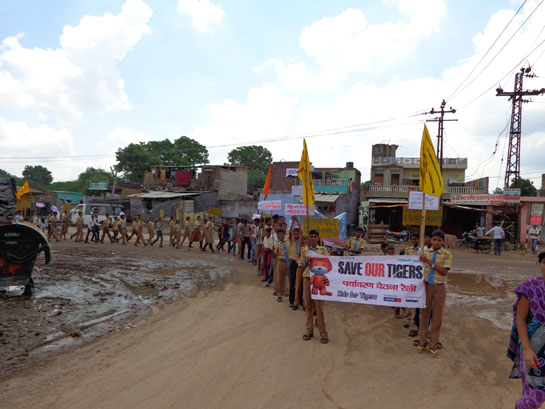 School children urge the Indian government to protect tigers and their habitats.