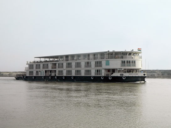 Mechanised dredging of river-bottom sediment is done for passage of large cruise ships such as these that ferry tourists on the Ganga.