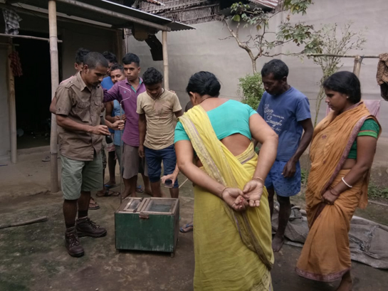 Manoj Gogoi after a successful snake rescue mission stands amongst a group of curious villagers as he sheds light on snake behavior and busts myths.
