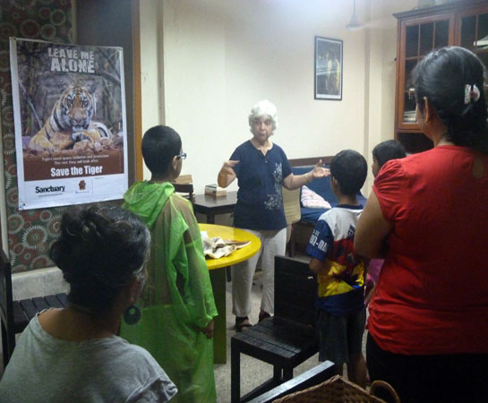 Katie Bagli speaks to families about saving the tiger.