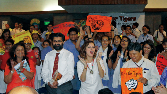 Seen here with Dr. Vijay Datta (left), Principal of Modern School, New Delhi, and Bishan Singh Bonal, Head, National Tiger Conservation Authority, her infectious enthusiasm rubs off on kids and adults alike.
