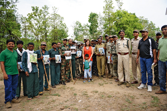 Dia interacts with forest guards of the Pench Tiger Reserve during the Kids for Tigers' National Camp 2014.