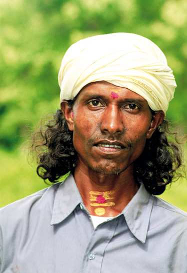 Chaturgun Oraon, among the best tiger trackers of Palamau,  a member of a small tribal cult peculiar to some Oroan tribals from the central Palamau Tiger Reserve. The vermilion on the forehead and neck, long hair and the turban are distinguishing traits.