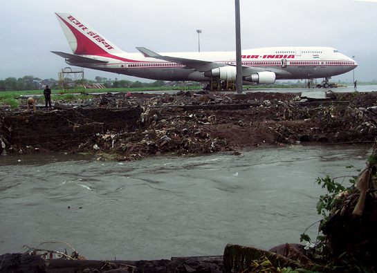 A Boeing frames the polluted banks of the Mithi river. Monga believes that some lessons will be learnt from the July 26 floods because ordinary citizens have seen the consequences of leaving life-and-death decisions to uncaring people.