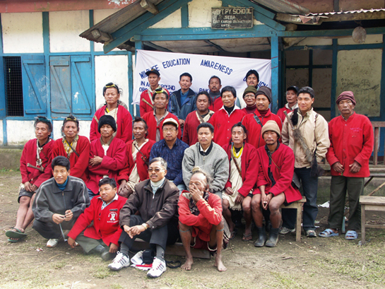 JOINT WILDLIFE SERVICE AWARD: Tana Tapi (second row, in a blue jacket) says: &acirc;The Ghora Aabhes or village fathers, such as Takum Nabum (sitting, front row, with glasses) and the Nishi people must share any credit for Pakke's wildlife success because they, including their women's self-help groups, are the Forest Department's eyes and ears.