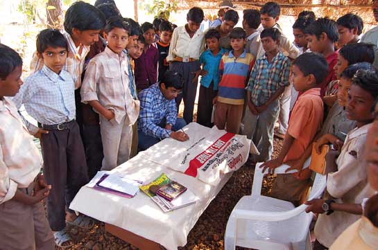 Praveen Pardeshi signs a Sanctuary Kids for Tigers' scroll created by school children to encourage the government to protect tigers.
