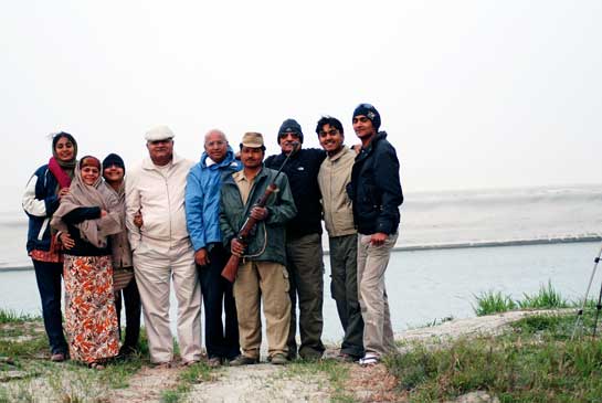 An avid nature-lover, Ramadorai (centre in blue) and his wife Mala gravitate towards wilderness areas as frequently as possible. They are seen here, against the backdrop of the Brahmaputra river, in the Kaziranga National Park.