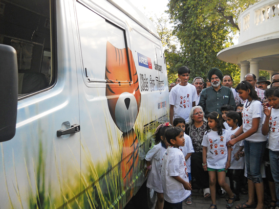 Former environment minister of Rajasthan Bina Kak launches the Tiger Express in Jaipur. Since then Govardhan and his Tiger Express van have been traversing the landscape of Ranthambhore, taking villagers, including women and children on awareness journeys into the forest.
