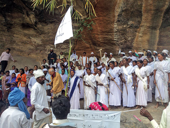 The Tana Bhagats of Thethangi take part in a worship ritual at the Thethangi rock-art site in Satpahar range.