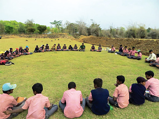 Vanamitra members conduct a nature-awareness session for tribal students at a nature camp in the Nagarahole Tiger Reserve.