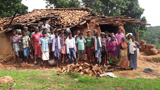 Locals stand in front of a house destroyed by a herd of elephants in Dharamjaygarh. Villagers here are embroiled in severe Human-elephant conflict and suffer grave losses in the form of life and property.