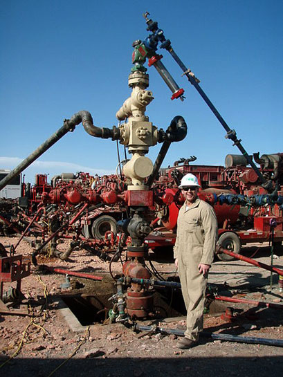 Fracking wellhead where fluids are injected at high pressure deep underground.