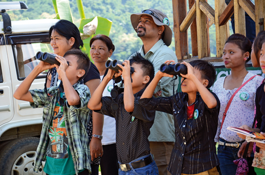 Banu Haralu (extreme left), whose committed efforts helped save the Amur Falcons, is seen here with young tourists in Nagaland. Responsible and ethical ecotourism through sustained management is the key to a balanced nature conservation paradigm. 