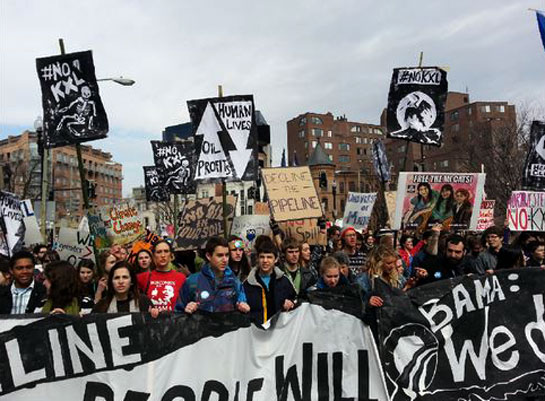 One thousand young activists marched from Georgetown University, where President Obama delivered a speech on climate change last June, to the White House. Signs read, &acirc;Hope and Change Not Climate Change,
